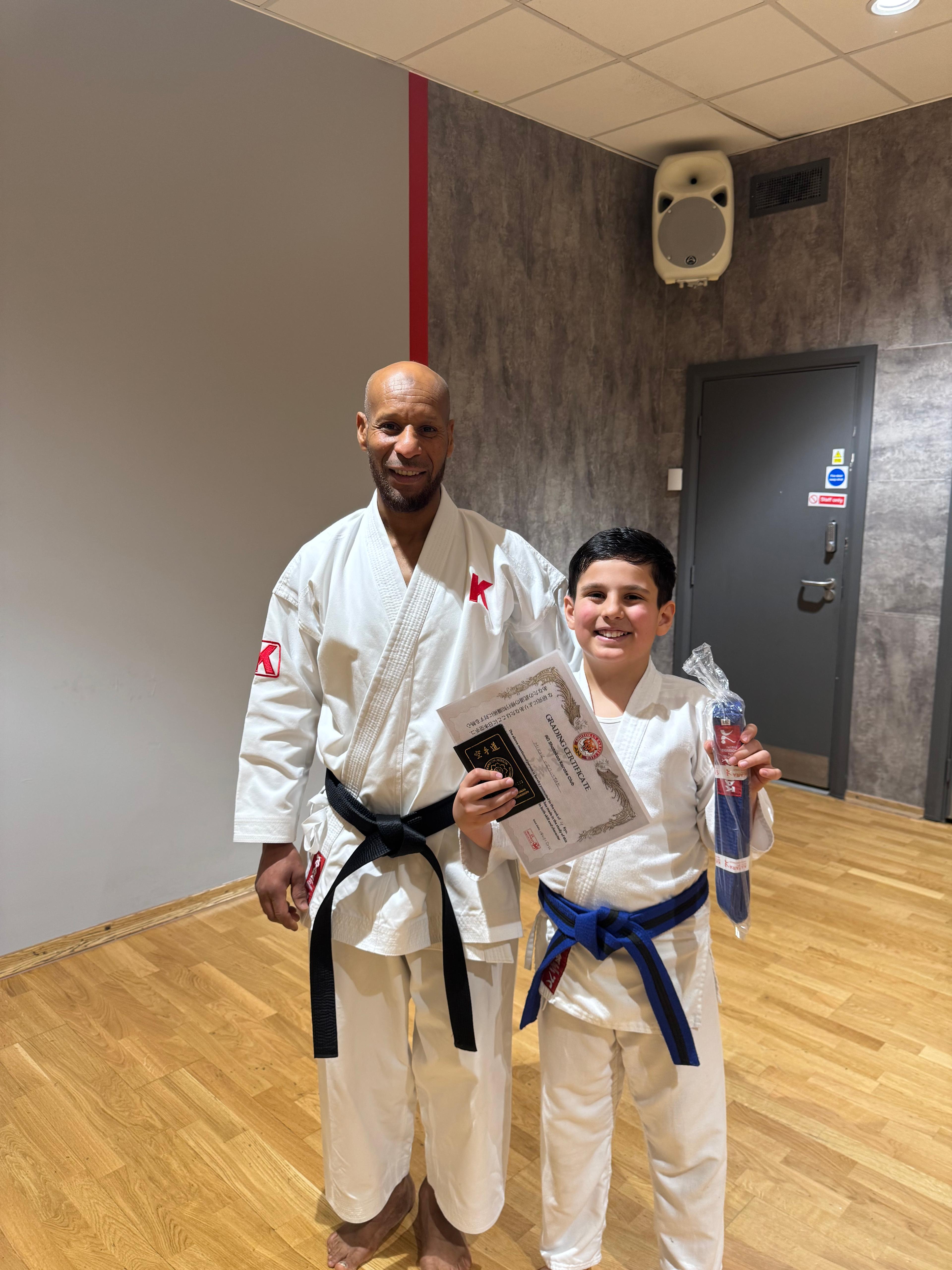 AN Shotokan Karate grading day ceremony with students receiving belts